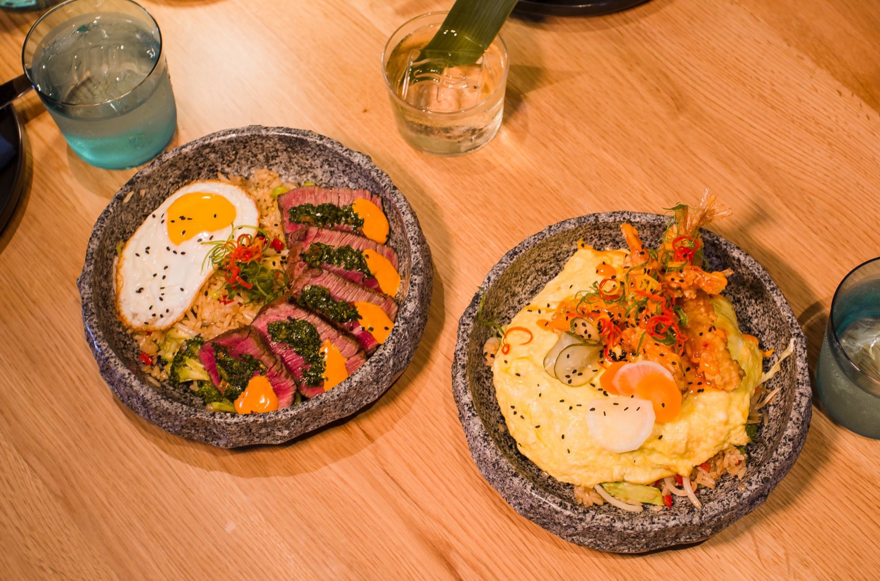 Steak fried rice and shrimp fried rice served in granite bowls